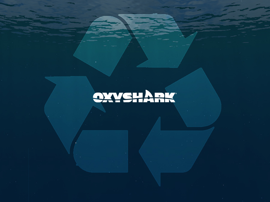 oxyshark logo on a background of water with recycle symbol